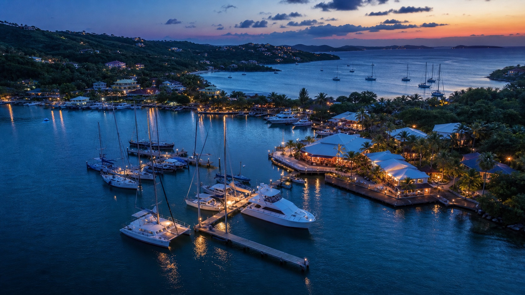 Drone still of a marina and waterfront venue at blue hour